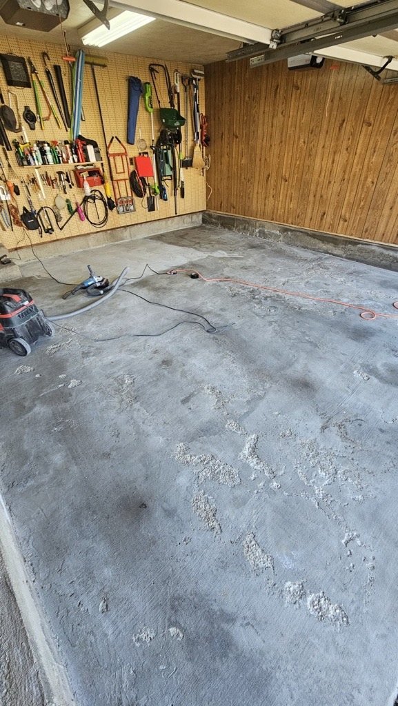 Bare concrete garage floor before coating