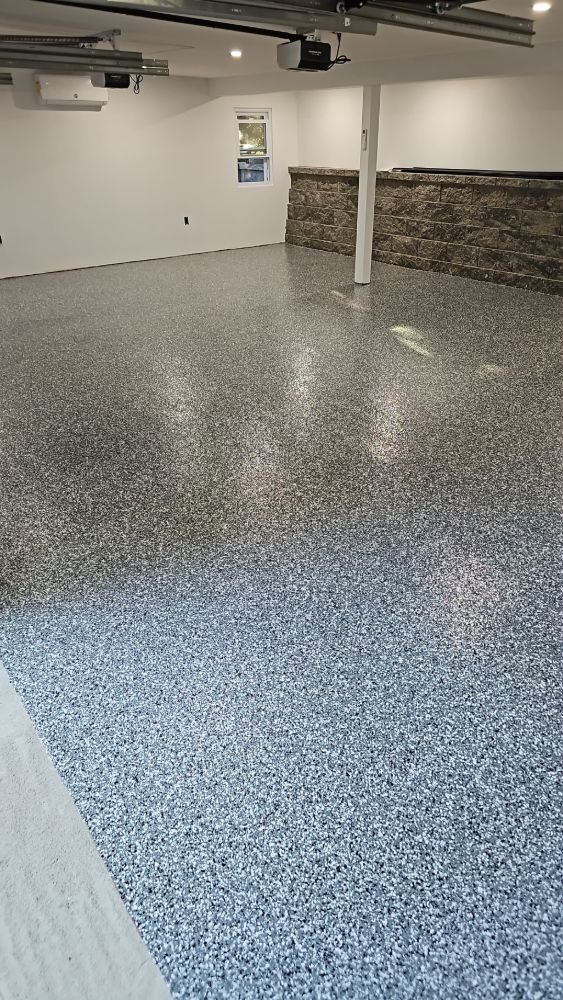 Wide finished epoxy flake floor in a Long Island basement garage