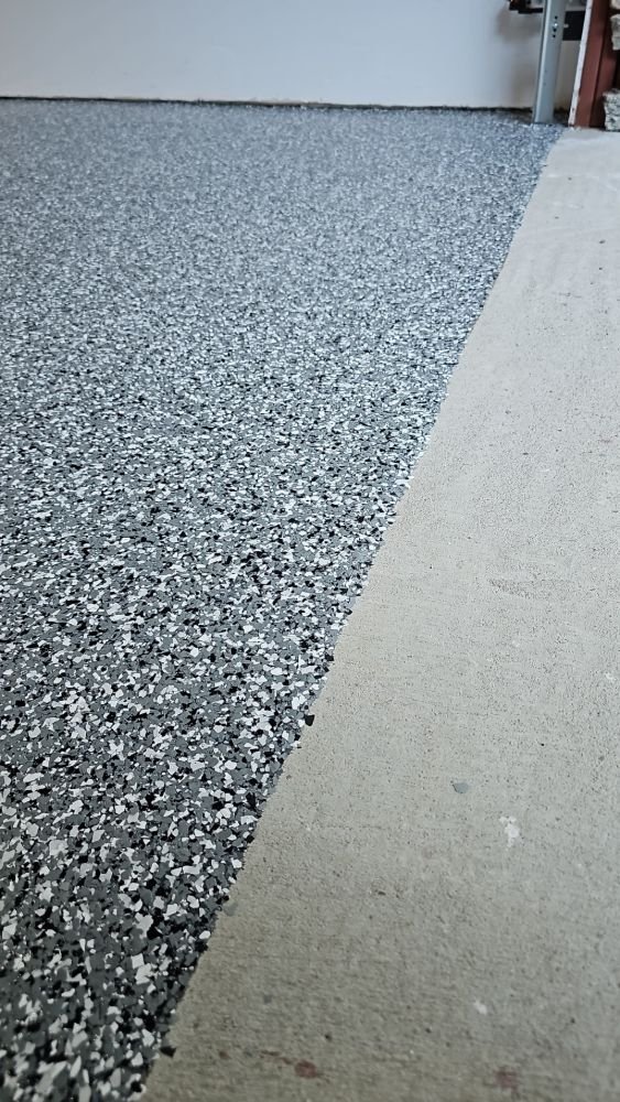 Epoxy flake coating going down over bare concrete